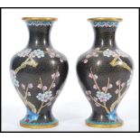 A 20th century pair of Chinese Cloisonne on brass baluster vases having decoration of flowers on