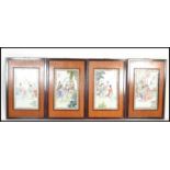 A set of four 20th century Chinese hardwood framed ceramic panels decorated with typical domestic