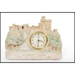 A vintage early 20th century chalk ware model of Windsor castle with inset barrel mantel clock.