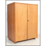 A 1970's Scandinavian retro teak wood office Industrial cube desk - filing cabinet having twin