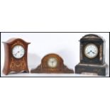 A group of three vintage mantel clock comprising of a mahogany Edwardian boxwood inlaid clock, black