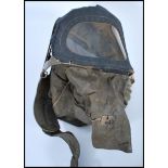 A WWII Second World War baby's / infants Civilian gas mask, made with khaki canvas and window to the