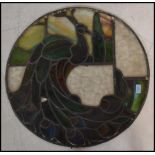 A fantastic 19th century stained glass window depicting a peacock. Coloured glass leaded panels with
