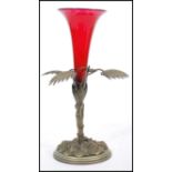 A 19th century white metal and cranberry glass epergne centrepiece vase. The base in the form of a