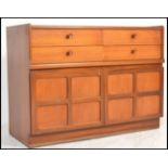 A retro 20th Century teak wood Nathan sideboard / credenza having four drawers to the top with