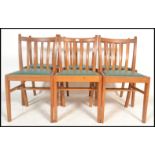 A set of six vintage A / C stamped rail back dining chairs dated 1962, with drop in seat pads raised