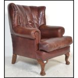 A good contemporary antique style Chesterfield armchair upholstered in a good brown leather.
