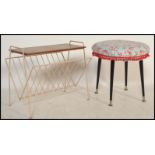 A retro / vintage mid 20th Century foot stool raised on four tapering legs with a circular stool