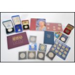 A collection of Proof and commemorative coins including a Queen Mother silver proof Crown, Centenary
