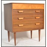 A retro 20th century, circa 1970's teak wood pedestal chest of drawers. Raised on shaped tapering
