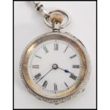 A continental silver 935 ladies pocket fob watch set to a decorative silver albert chain. The