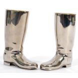 A pair of 20th Century silver plated drinks measures in the form of riding boots having raised