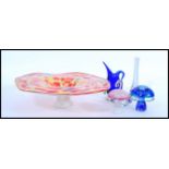 A selection of studio / art glass to include a red and yellow speckled glass centerpiece bowl,