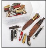 A collection of vintage and retro hunting knives, pen knives to include Swiss Army, military