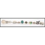 A selection of silver rings to include a green agate and silver ring, a celtic platted design