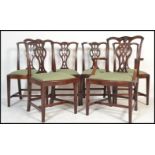 A set of 6 early 19th century George III Chippendale revival mahogany dining chairs. Raised on