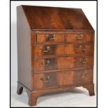 An 20th century Georgian Revival reproduction mahogany bureau bookcase having a fall front with