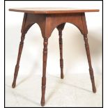 A 19th Century mahogany Victorian Arts and Craft aesthetic movement side table raised on four