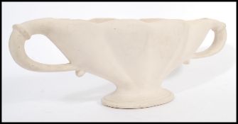 A vintage 20th century cream glazed pottery plant vase / table centerpiece, influenced by florist