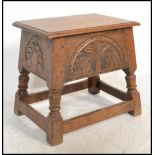 A Jacobean 17th century revival coffin stool box. Raised on block and turned legs with peripheral