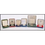 A collection of six cased silver proof coins / medals to include a 1981 silver proof coin for