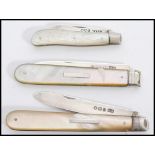A group of three silver hallmarked and mother of pearl handled fruit pen knives. One hallmarked