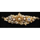A signed  1950s Miriam Haskell Frank Hess gold-tone brooch having metal findings filigree work, faux