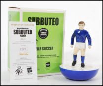 A Royal Doulton ceramic advertising figurine of a Subbuteo player in blue and white kit. MCL12 142/