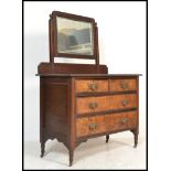 A late 19th Century Victorian burr walnut dressing table chest, swing mirror to the top over two