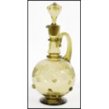 A 19th century green glass claret jug decanter in the manner of Roemer having a large bulbous body
