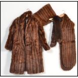 A set of vintage furs comprising of fur coat with matching stole and scarf. Makers label to