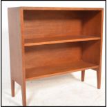 A retro 20th Century Danish influenced teak wood open bookcase, having a single adjustable shelf