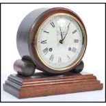 An early 20th century Edwardian Comitti Of London mahogany cased mantle bracket clock. Raised on