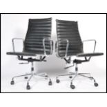 After Charles & Ray Eames - EA 119 - Aluminium group - A pair of Vitra type swivel desk chairs