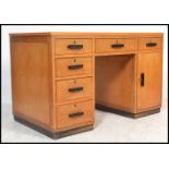 A good 1930's Art Deco golden oak twin pedestal desk - Air Ministry manner. The green writing