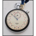 A vintage 20th century Tag Heuer stopwatch timer complete in original box. White enamel face with