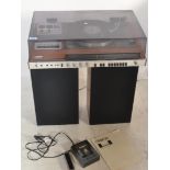 A retro teak cased HMK - 70 Sony music system, record deck, radio and tape deck, lift up acrylic top