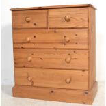 A good quality antique style country pine 2 over 3 chest of drawers. Raised on a plinth base with