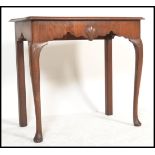 An 18th century Georgian mahogany Irish side table, the side table raised on large cabriole legs