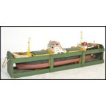 A very large scratch built wooden and metal model of a boat with inset engine complete with