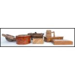 A collection of vintage treen ware dating from the 19th century to include a coconut carved into a