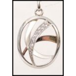 A stamped 925 silver pendant necklace having a oval shaped pendant with inset cz's,. Weight 12.9g.