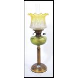 A Victorian 19th century Loetz glass and brass oil lamp. The neo-classical brass body with reeded