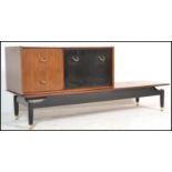 A vintage retro 20th century G-Plan Librenza coffee table along with a matching G-Plan cabinet.