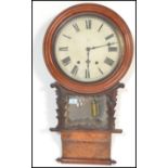 A Victorian 19th century wall clock with large dial, roman numeral chapter ring having glass