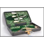 A fabulous 19th century Victorian cased sewing set in fitted case. Consists of carved mother of