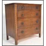 A Jaycee medium oak chest of four graduating drawers, flared top raised on stile supports. Measure: