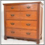 An Edwardian walnut 2 over 3 chest of drawers. Raised on reeded stile legs with 2 short over 3