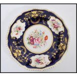 A 19th century Bloor Derby cabinet plate having a deep painted blue cobalt ground with hand