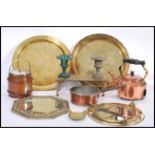 A collection of copper and brass dating from the 19th century to include copper victorian pan, brass